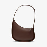 Brown leather handbag on a white background