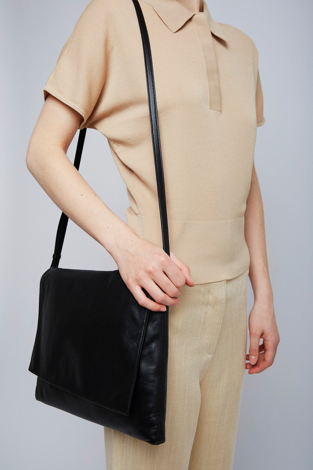 The Row | Nan black leather messenger bag | Savannahs