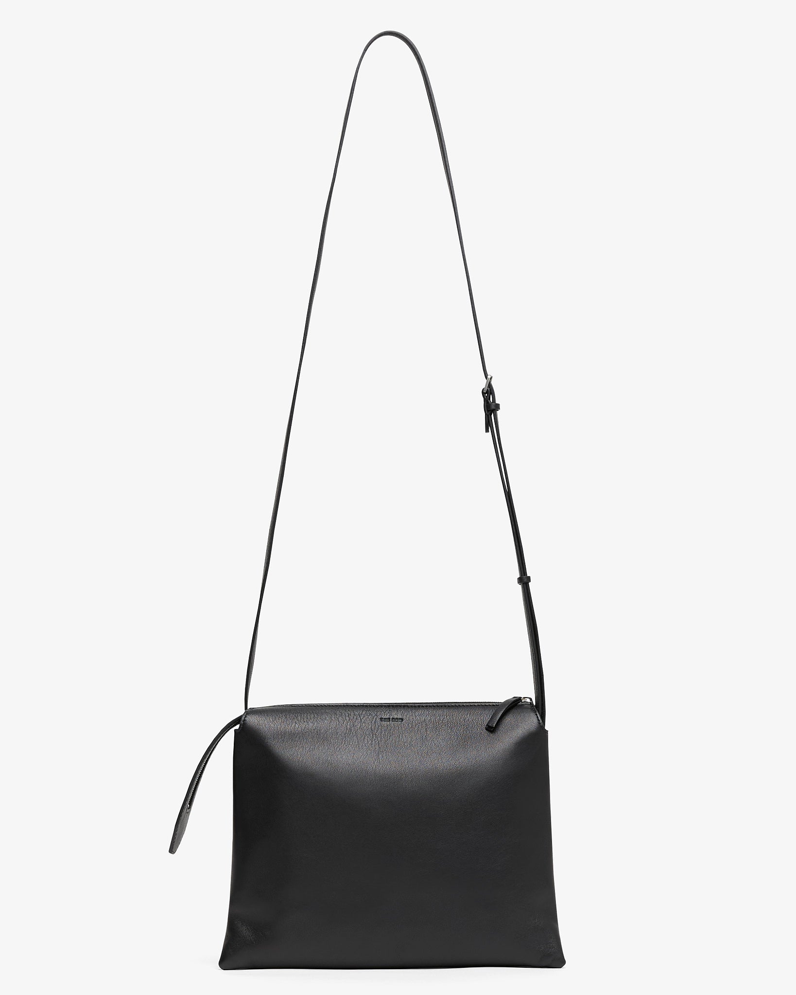 Black leather crossbody bag on a white background