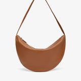 Brown leather handbag on a white background