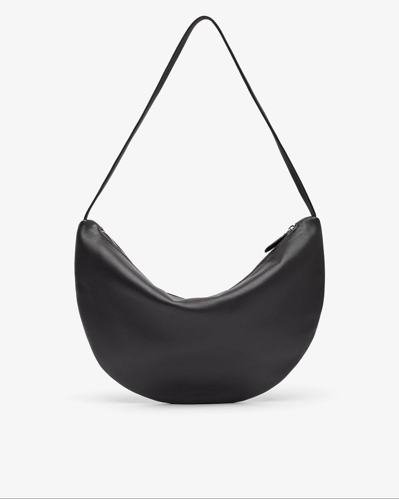 Black leather handbag with a strap on a white background