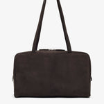 Brown leather handbag with a shoulder strap on a white background