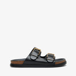 Black sandal with gold buckles on a white background