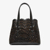 Black perforated handbag on a white background