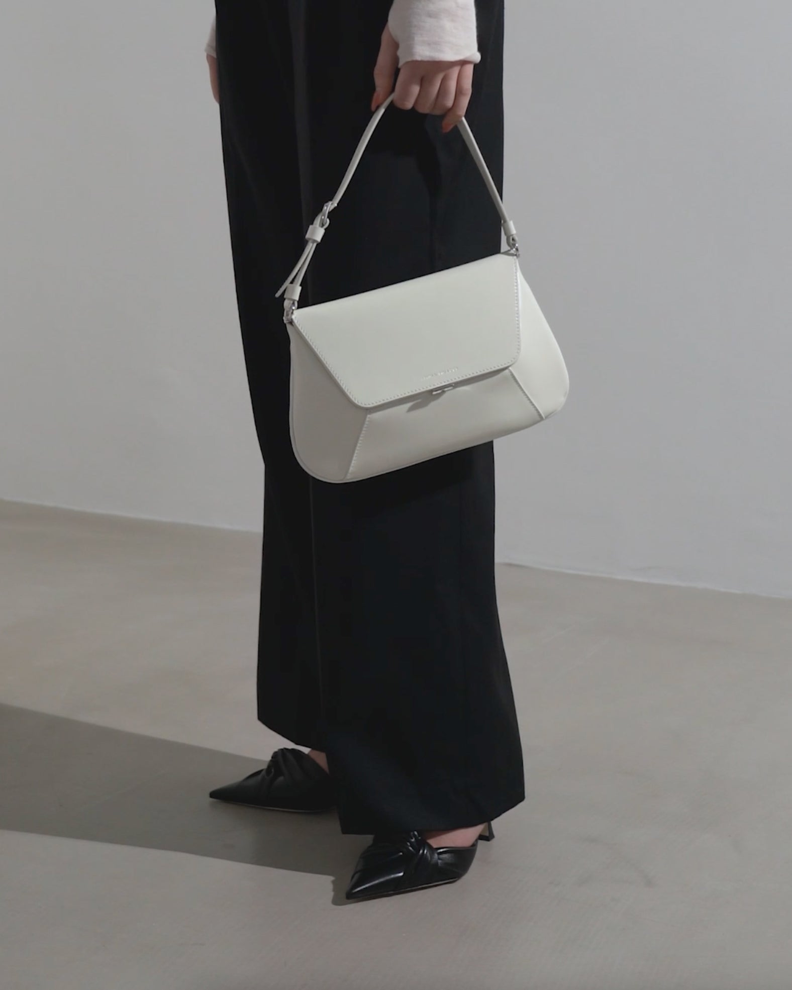Amina Muaddi | Ami Spazzolato white leather bag | Savannahs