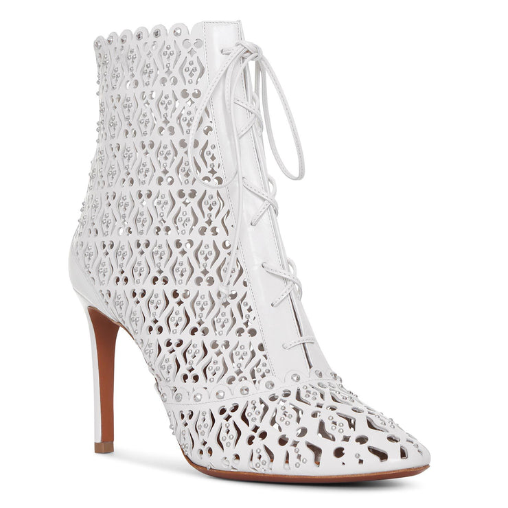 White laser cut lace-up ankle boots