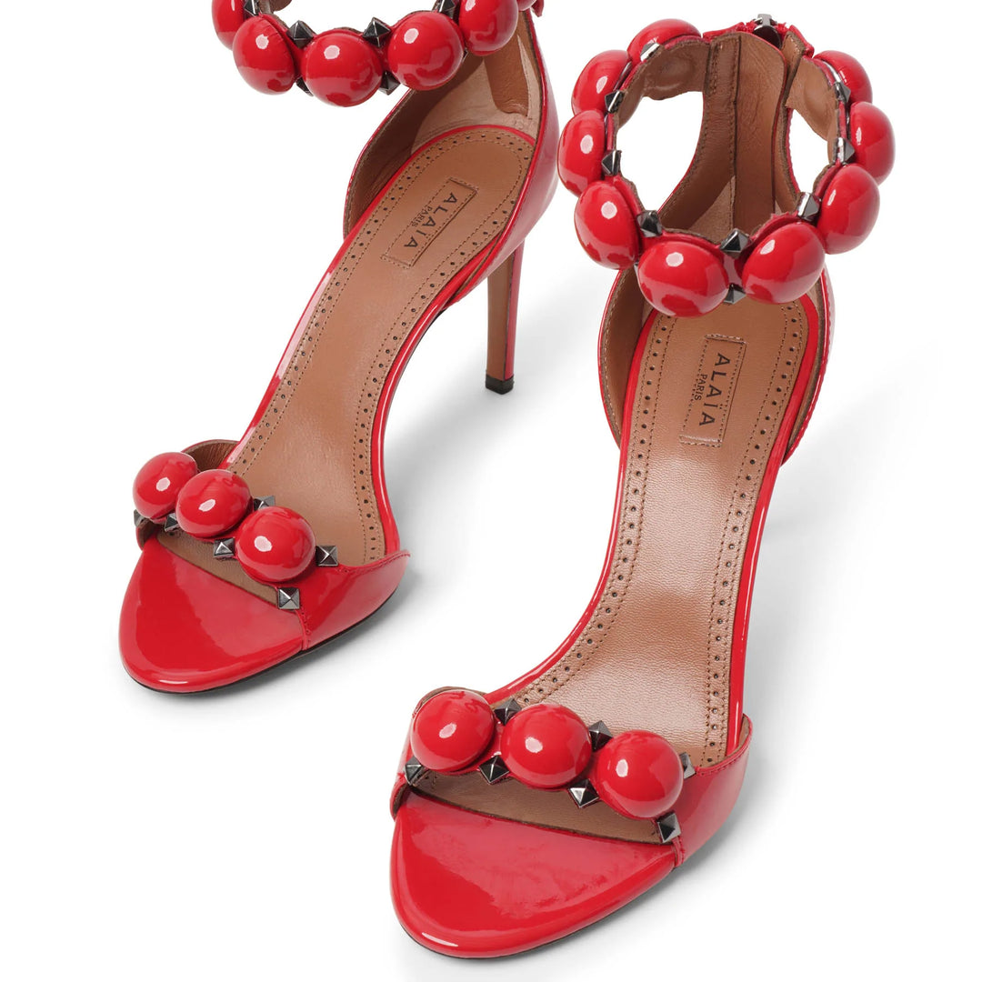 Alaïa | La Bombe 90 patent red sandals | Savannahs