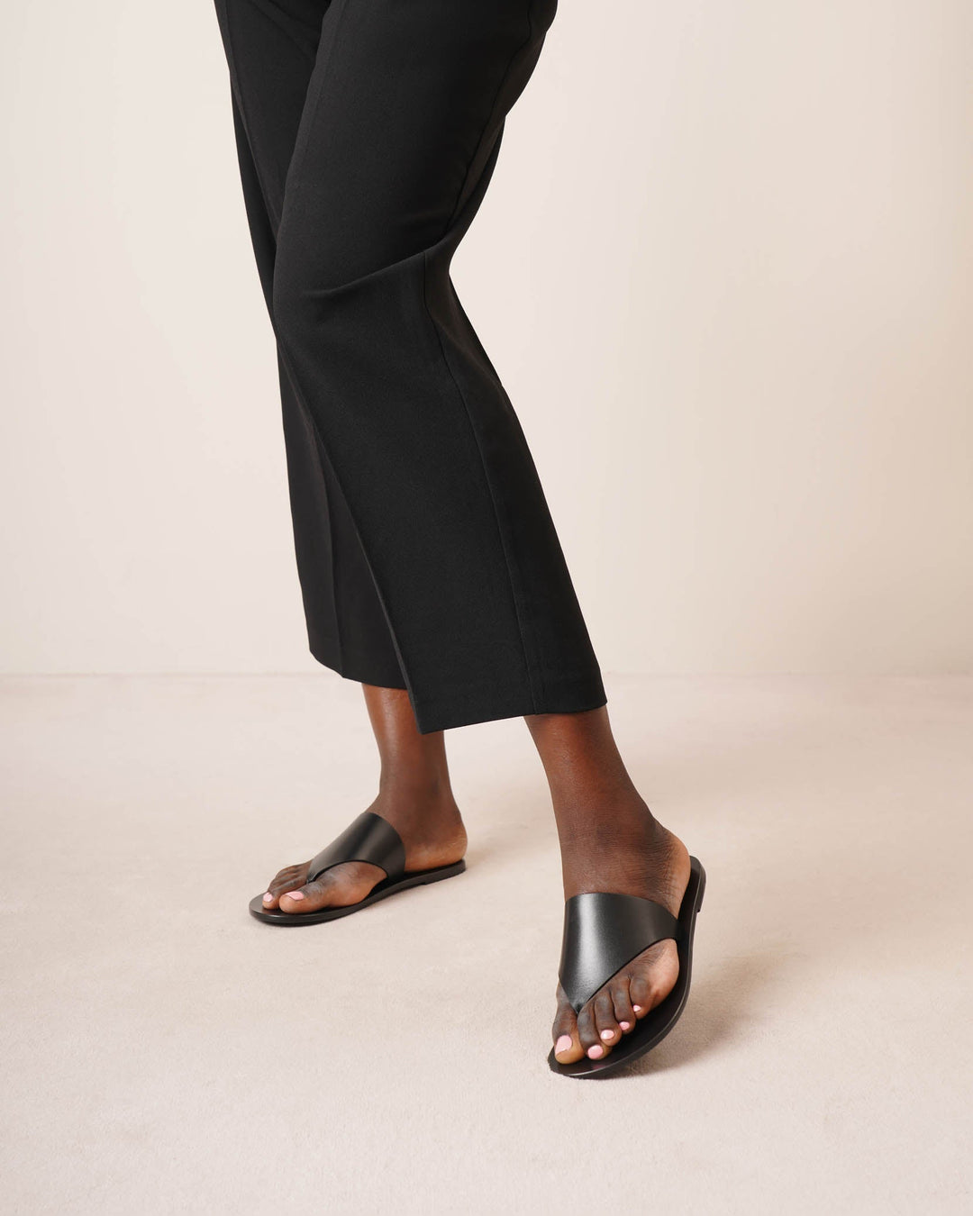 The Row | Avery black leather thong sandals | Savannahs